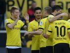 Dortmund's striker Marco Reus (L) celebrates with his teammates after scoring during the German first division Bundesliga football match Borussia Dortmund vs FSV Mainz in the German city of Dortmund on April 20, 2013. AFP PHOTO / PATRIK STOLLARZ

DFL RULES TO LIMIT THE ONLINE USAGE DURING MATCH TIME TO 15 PICTURES PER MATCH. IMAGE SEQUENCES TO SIMULATE VIDEO IS NOT ALLOWED AT ANY TIME. FOR FURTHER QUERIES PLEASE CONTACT DFL DIRECTLY AT + 49 69 650050.        (Photo credit should read PATRIK STOLLARZ/AFP/Getty Images)