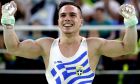 Greece's Eleftherios Petrounias celebrates after his performance on the rings during the artistic gymnastics men's apparatus final at the 2016 Summer Olympics in Rio de Janeiro, Brazil, Monday, Aug. 15, 2016. (AP Photo/Julio Cortez)