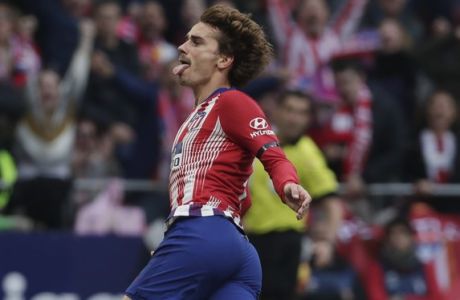 Atletico Madrid's Antoine Griezmann celebrates after scoring his sides 1st goal during a Spanish La Liga soccer match between Atletico Madrid and Real Madrid at the Metropolitano stadium in Madrid, Spain, Saturday, Feb. 9, 2019. (AP Photo/Manu Fernandez)