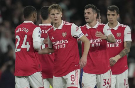 Arsenal's Martin Odegaard, centre, celebrates after the English Premier League soccer match between Arsenal and Chelsea at the Emirates Stadium in London, Tuesday, May 2, 2023. (AP Photo/Kin Cheung)