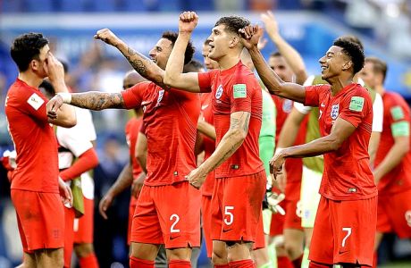 England team players celebrate their victory over Sweden at the end of the quarterfinal match between Sweden and England at the 2018 soccer World Cup in the Samara Arena, in Samara, Russia, Saturday, July 7, 2018. (AP Photo/Matthias Schrader )