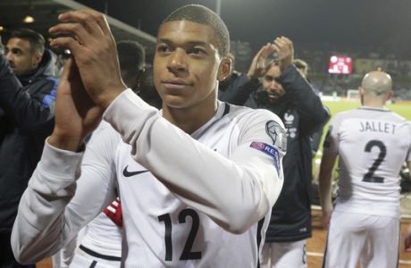 France's Kylian Mbappe celebrates after defeating Luxembourg during the World Cup 2018 Group A qualifying soccer match at the Josy Barthel stadium in Luxembourg on Saturday, March 25, 2017. (AP Photo/Olivier Matthys)