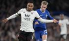 Chelsea's Mykhailo Mudryk vies for the ball with Fulham's Kenny Tete, left, during the English Premier League soccer match between Chelsea and Fulham at Stamford Bridge stadium in London, Friday, Feb. 3, 2023. (AP Photo/Kirsty Wigglesworth)