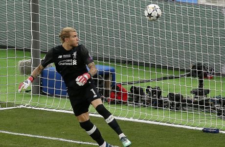 FILE - Liverpool goalkeeper Loris Karius looks at the ball after a fumble allowed Real Madrid's Gareth Bale to score his side's 3rd goal during the Champions League Final soccer match between Real Madrid and Liverpool at the Olimpiyskiy Stadium in Kiev, Ukraine, May 26, 2018. Liverpool has confirmed the departure of goalkeeper Loris Karius four years after his last appearance for the club when his concussion-related gaffes contributed to a 3-1 loss to Real Madrid in the 2018 Champions League final. (AP Photo/Darko Vojinovic, File)