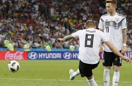 Germany's Toni Kroos, left, scores his side's second goal during the group F match between Germany and Sweden at the 2018 soccer World Cup in the Fisht Stadium in Sochi, Russia, Saturday, June 23, 2018. (AP Photo/Frank Augstein)