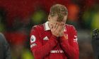 Manchester United's Donny van de Beek leaves the pitch after being injured during the English Premier League soccer match between Manchester United and Bournemouth at Old Trafford in Manchester, England, Tuesday, Jan. 3, 2023. (AP Photo/Dave Thompson)