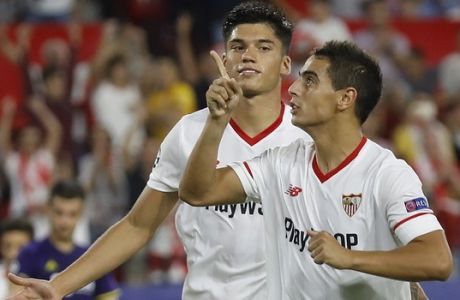 Sevilla's Wissam Ben Yedder, right, celebrates after scoring his side third goal, with his teammate Joaquin Correaduring the Cha mpions League Group E soccer match between Sevilla and Maribor at the stadium Ramón Sánchez Pizjuán in Seville, Spain, Tuesday, Sept. 26, 2017. (AP Photo/Miguel Morenatti)