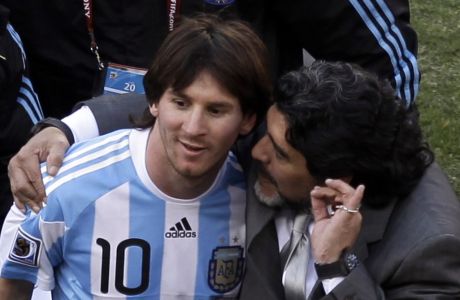 Argentina head coach Diego Maradona, right, and Argentina's Lionel Messi, left walk off the pitch after  the World Cup group B soccer match between Argentina and South Korea at Soccer City in Johannesburg, South Africa, Thursday, June 17, 2010. Argentina won 4-1.  (AP Photo/Marcio Jose Sanchez)