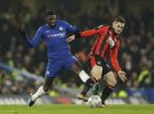 Chelsea's Tiemoue Bakayoko, left, challenges for the ball with Bournemouth's Lewis Cook during the English League Cup quarterfinal soccer match between Chelsea and Bournemouth at Stamford Bridge stadium in London, Wednesday, Dec. 20, 2017. (AP Photo/Alastair Grant)