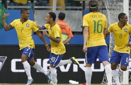 Brazil's Douglas Costa, left, celebrates with teammate Neymar after scoring against Peru during a 2018 World Cup qualifying soccer match in Salvador, Brazil, Tuesday, Nov. 17, 2015. (AP Photo/Andre Penner)