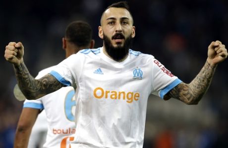 Marseille's Konstantinos Mitroglou celebrates after his goal during the League One soccer match between Marseille and Lyon at the Velodrome stadium, in Marseilles, southern France , Sunday, March 18, 2018. (AP Photo/Claude Paris)