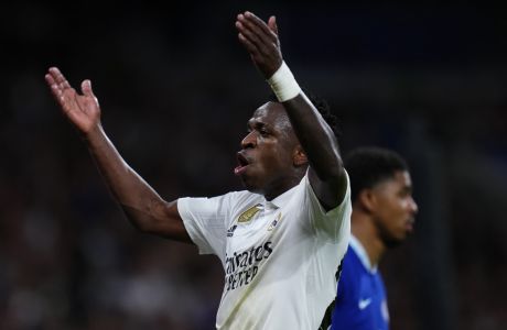 Real Madrid's Vinicius Junior reacts during the Champions League quarterfinal, first leg, soccer match between Real Madrid and Chelsea at the Santiago Bernabeu stadium in Madrid, Spain, Wednesday, April 12, 2023. (AP Photo/Manu Fernandez)
