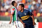 Andres Chavez of Argentina's Boca Juniors, center, celebrates after scoring against Chile's Palestino during a Copa Libertadores soccer match in Santiago, Chile, Wednesday, Feb. 18, 2015. (AP Photo)