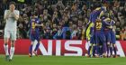 Chelsea's Marcos Alonso, left, covers his face as Barcelona players celebrate scoring their side's second goal during the Champions League round of sixteen second leg soccer match between FC Barcelona and Chelsea at the Camp Nou stadium in Barcelona, Spain, Wednesday, March 14, 2018. (AP Photo/Emilio Morenatti)
