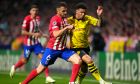 Atletico Madrid's Koke, centre, challenges for the ball with Dortmund's Jadon Sancho during the Champions League quarterfinal soccer match between Atletico Madrid and Borussia Dortmund at the Metropolitano stadium in Madrid, Spain, Wednesday, April 10, 2024. (AP Photo/Manu Fernandez)