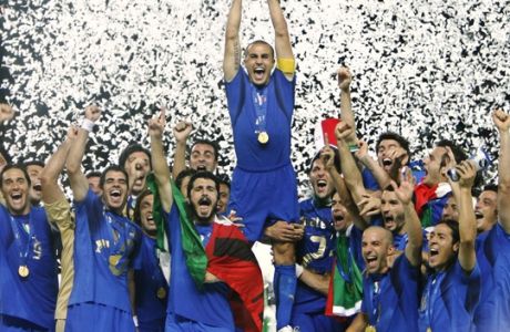 ** FILE **  Italy's Fabio Cannavaro lifts the trophy after defeating France 5-3 in a shootout in the final of the soccer World Cup between Italy and France in the Olympic Stadium in Berlin, Sunday, July 9, 2006. (AP Photo/Luca Bruno) ** zu unserem Paket 'DEU FUSSBALL WM RUECKBLICK' **