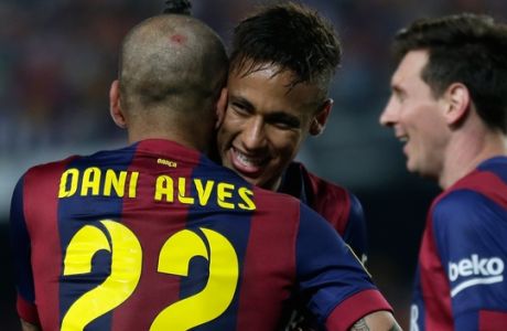Barcelona's Dani Alves, Neymar and Lionel Messi, from left to right, celebrate after scoring their third goal during the final of the Copa del Rey soccer match between FC Barcelona and Athletic Bilbao at the Camp Nou stadium in Barcelona, Spain, Saturday, May 30, 2015. (AP Photo/Manu Fernandez)