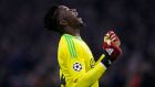 Ajax goalkeeper Andre Onana celebrates after his teammate Hakim Ziyech scoring his side's opening goal during the first leg, round of sixteen, Champions League soccer match between Ajax and Real Madrid at the Johan Cruyff ArenA in Amsterdam, Netherlands, Wednesday Feb. 13, 2019. (AP Photo/Peter Dejong)