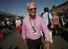 Red Bull and Toro Rosso team owner and founder of the energy drink brand Red Bull, Dietrich Mateschitz, walks the grid prior to the start of the season-opening Australian Grand Prix in Melbourne, Australia, Sunday March 16, 2008. (AP Photo/Oliver Multhaup)