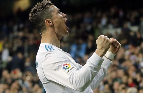 Real Madrid's Cristiano Ronaldo celebrates after scoring his second goal during a Spanish La Liga soccer match between Real Madrid and Girona at the Santiago Bernabeu stadium in Madrid, Spain, Sunday, March 18, 2018. (AP Photo/Paul White)