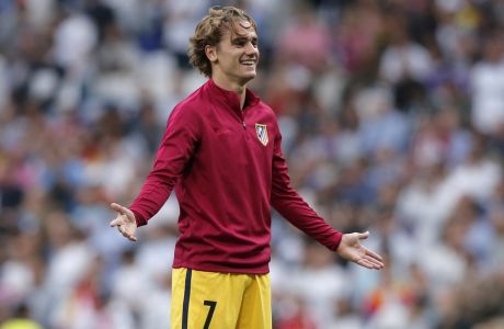 Atletico's Antoine Griezmann gestures during warm up before the Champions League semifinals first leg soccer match between Real Madrid and Atletico Madrid at Santiago Bernabeu stadium in Madrid, Spain, Tuesday May 2, 2017. (AP Photo/Daniel Ochoa de Olza)