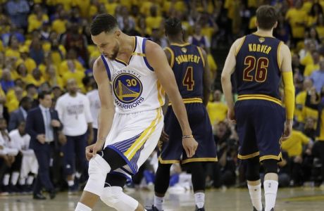 Golden State Warriors guard Stephen Curry (30) reacts after scoring against the Cleveland Cavaliers during the second half of Game 1 of basketball's NBA Finals in Oakland, Calif., Thursday, June 1, 2017. (AP Photo/Marcio Jose Sanchez)