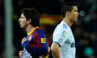 Real Madrid's Cristiano Ronaldo from Portugal, right, and FC Barcelona's Lionel Messi from Argentina, left, are seen during a Spanish La Liga soccer match at the Camp Nou stadium in Barcelona, Spain, Monday, Nov. 29, 2010. (AP Photo/Manu Fernandez)