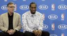 San Antonio Spurs Kawhi Leonard, right sits with Spurs general manager R.C. Buford, right, during a news conference where Leonard was named the NBA defensive player of the year , Monday, April 18, 2016, in Austin, Texas. (AP Photo/Eric Gay)
