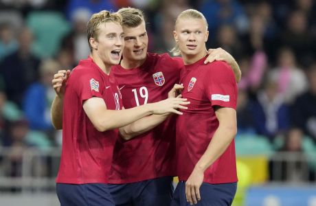 Norway's Kristian Thorstvedt, from left, Norway's Alexander Sorloth and Norway's Erling Haaland celebrate scoring their side's first goal during the UEFA Nations League soccer match between Slovenia and Norway at the Stozice stadium in Ljubljana, Slovenia, Saturday, Sept. 24, 2022. (AP Photo/Darko Bandic)