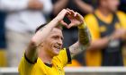 Dortmund's Marco Reus celebrates after he scored his side's fourth goal during the German Bundesliga soccer match between Borussia Dortmund and Augsburg, in Dortmund, Saturday, May 4, 2024. (AP Photo/Martin Meissner)
