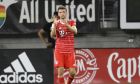 Bayern Munich forward Thomas Müller celebrates his goal during the second half of the team's soccer friendly against D.C. United, Wednesday, July 20, 2022, in Washington. Bayern Munich won 6-2. (AP Photo/Nick Wass)