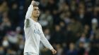 Real Madrid's Cristiano Ronaldo celebrates his team's win after the end the Champions League soccer match, round of 16, 1st leg between Real Madrid and Paris Saint Germain at the Santiago Bernabeu stadium in Madrid, Spain, Wednesday, Feb. 14, 2018. Real Madrid won 3-1. (AP Photo/Paul White)