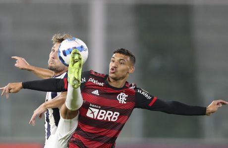 Victor Hugo of Brazil's Flamengo, right, and Angelo Martino of Argentina's Talleres battle for the ball during a Copa Libertadores soccer match in Cordoba, Argentina, Wednesday, May 4, 2022. (AP Photo/Nicolas Aguilera)