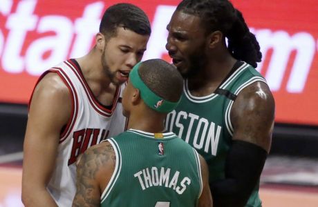 Chicago Bulls' Michael Carter-Williams, left, has words with Boston Celtics' Isaiah Thomas (4) as Jae Crowder comes between the pair during the second half in Game 4 of an NBA basketball first-round playoff series in Chicago, Sunday, April 23, 2017. The Celtics won 104-95. (AP Photo/Charles Rex Arbogast)
