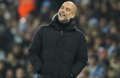 Manchester City's head coach Pep Guardiola reacts during the English League Cup soccer match between Manchester City and Liverpool at Etihad stadium in Manchester, England, Thursday, Dec. 22, 2022. (AP Photo/Jon Super)