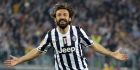 Juventus' midfielder Andrea Pirlo celebrates after scoring during the UEFA Europa League quarter-final football match Juventus vs Olympique Lyonnais, on April 10, 2014 at the Juventus stadium in Turin.   AFP PHOTO / OLIVIER MORIN        (Photo credit should read OLIVIER MORIN/AFP/Getty Images)
