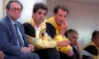 Από αριστερά προς τα δεξιά σε πρώτο πλάνο, ο διαχρονικός παράγοντας της ΑΕΚ, Νίκος Στράτος, ο βοηθός προπονητή, Πέτρος Ραβούσης, και ο προπονητής της Ένωσης, Ντούσαν Μπάγεβιτς, σε αγώνα για την Α' Εθνική 1995-1996 στη Νέα Σμύρνη με αντίπαλο τον Πανιώνιο (29/05/1996)
