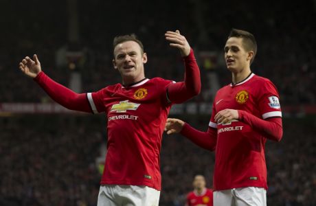 Manchester United's Wayne Rooney, left, celebrates with teammate Adnan Januzaj after scoring his second goal during the English Premier League soccer match between Manchester United and Sunderland at Old Trafford Stadium, Manchester, England, Saturday Feb. 28, 2015. (AP Photo/Jon Super)  