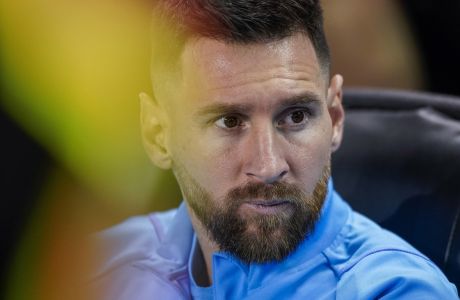Argentina forward Lionel Messi sits before the team's international friendly soccer match against Jamaica on Tuesday, Sept. 27, 2022, in Harrison, N.J. (AP Photo/Eduardo Munoz Alvarez)