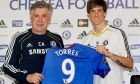 Chelsea's new signing Spain striker Fernando Torres, right, poses for a photograph with manager Carlo Ancelotti during a press conference at the club's training ground in Cobham, England, Friday, Feb. 4, 2011. (AP Photo/Kirsty Wigglesworth)