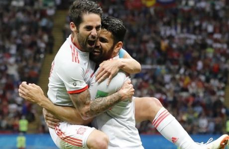 Spain's Diego Costa, right, celebrates with his teammate Isco after scoring his side's opening goal during the group B match between Iran and Spain at the 2018 soccer World Cup in the Kazan Arena in Kazan, Russia, Wednesday, June 20, 2018. (AP Photo/Frank Augstein)