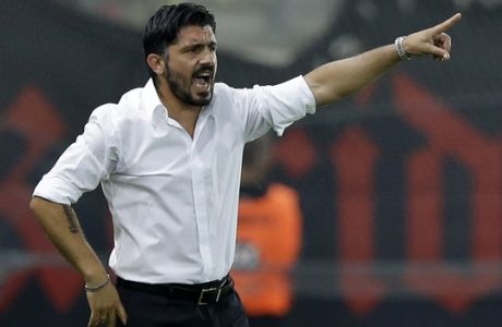 FILE - In this Sept. 13, 2014 file phtoto, OFI's coach Gennaro Gattuso of Italy gives instructions to his players during a Greek Soccer League match at the Georgios Karaiskakis stadium against Olympiacos in the port of Piraeus, near Athens. On Monday, Nov. 27, 2017 AC Milan fired Vincenzo Montella and named Gennaro Gattuso as coach Monday after the club failed to produce inspiring results with a completely revamped squad.  (AP Photo/Thanassis Stavrakis file)