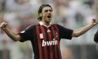 FILE - AC Milan defender Paolo Maldini salutes his fans at the end of his last match at the San Siro stadium, after 24 years and 901 games for the club, on May 24, 2009. AC Milan's Fikayo Tomori could hardly have dreamt of a better start to life at AC Milan. The English defender helped Milan win the Serie A title in his first full season with the club and the Rossoneri are now back at the top of European soccer.  (AP Photo/Alberto Pellaschiar, File)