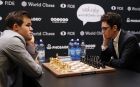 Reigning chess world champion, Norway's Magnus Carlsen, left, and Italian-American Fabiano Caruana wait for the start at the final day of the World chess Championship in London, Wednesday, Nov. 28, 2018.(AP Photo/Frank Augstein)