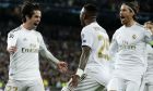 Real Madrid's Isco, left, celebrates with teammates after scoring his side's opening goal during the Champions League, round of 16, first leg soccer match between Real Madrid and Manchester City at the Santiago Bernabeu stadium in Madrid, Spain, Wednesday, Feb. 26, 2020. (AP Photo/Manu Fernandez)
