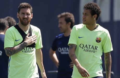 FC Barcelona's Lionel Messi, left, and Neymar attend a training session at the Sports Center FC Barcelona Joan Gamper in Sant Joan Despi, Spain, Friday, May 26, 2017. FC Barcelona will play against Alaves in the Spanish Copa del Rey soccer final on Saturday May 27. (AP Photo/Manu Fernandez)