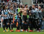 Newcastle United's Jonas Gutierez, center, celebrates his goal with his teammates during the English Premier League soccer match between Newcastle United and West Ham United's  at St James' Park, Newcastle, England, Sunday, May 24, 2015. (AP Photo/Scott Heppell)
