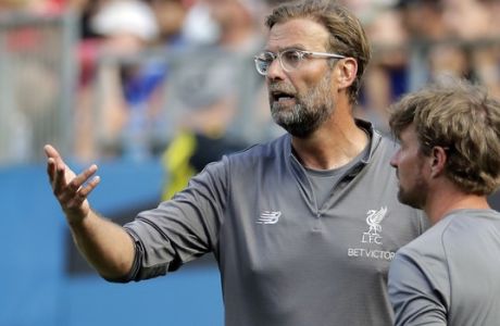Liverpool manager Jurgen Klopp directs his team against Borussia Dortmund during the second half of an International Champions Cup tournament soccer match in Charlotte, N.C., Sunday, July 22, 2018. (AP Photo/Chuck Burton)