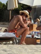 EXCLUSIVE: Manchester United flop Marouane Fellaini puffs on a giant cigar - just days after Belgium were dumped out of Euro 2016 by Wales. The Belgian star, 28, was spotted relaxing on holiday in Ibiza with twin brother Mansour. An onlooker said: He didnt look like he had a care in the world. The group enjoyed drinks in the sunshine yesterday (July 4) surrounded by bikini-clad girls. Fellaini - in sunglasses and a hat - was seen knocking back what appeared to be cocktails and posing for photos with a fan. Pre-tournament favourites Belgium were knocked out of the competition after losing to Wales 3-1 on July 1. Fellaini has struggled to meet expectations at Old Trafford since signing with the club in the summer of 2013. Pics taken July 4th.