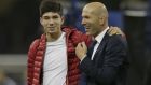 Real Madrid's head coach Zinedine Zidane is embraced by his son Luca at the end of the Champions League final soccer match between Juventus and Real Madrid at the Millennium Stadium in Cardiff, Wales, Saturday June 3, 2017. (AP Photo/Tim Ireland)